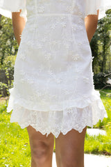 Adelaide mini-jurk van wit katoen met broderie